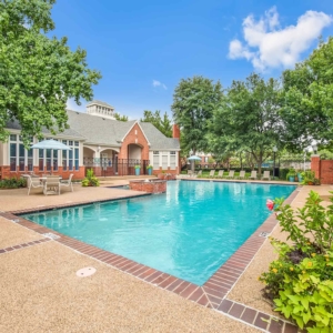 The Pool at the Lexington at Valley Ranch with mature landscaping and a bright blue sky