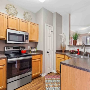 kitchen with stainless appliances and wood look floor