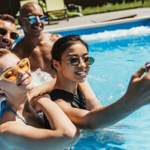 friends taking pool selfie